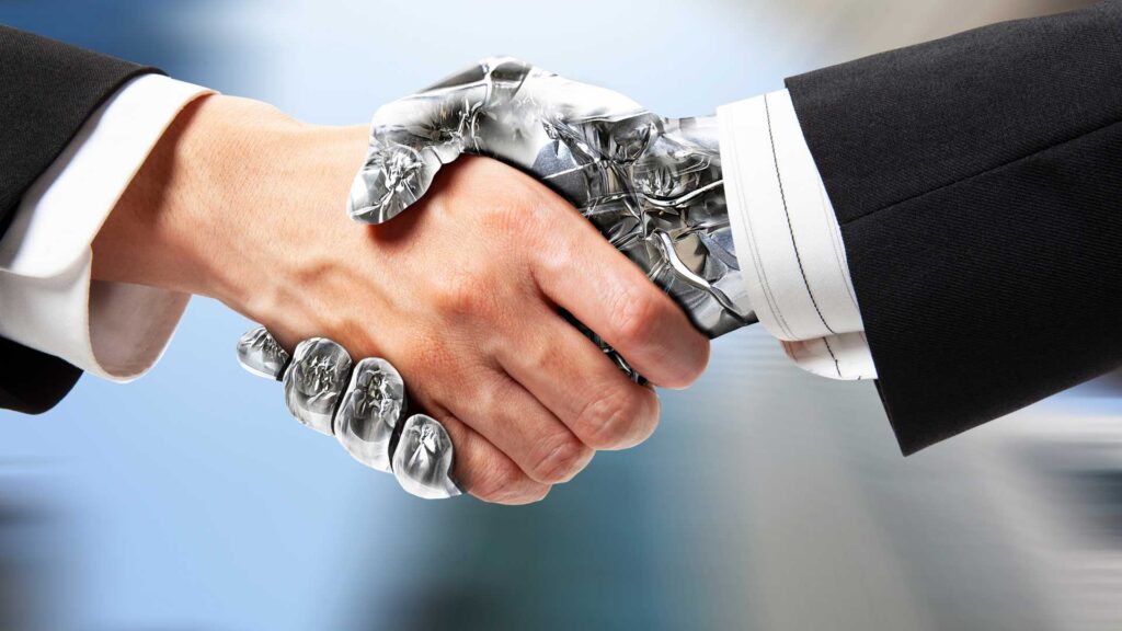 main d'un robot qui sert la main d'un humain